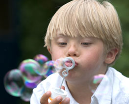 down-syndrome-child-blowing-bubbles.jpg